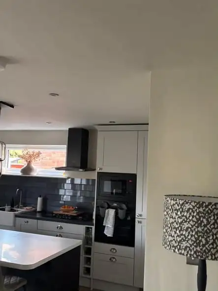 Freshly decorated kitchen with white units and cream walls in Fenny Drayton